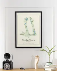 Member Course map print, framed in a room